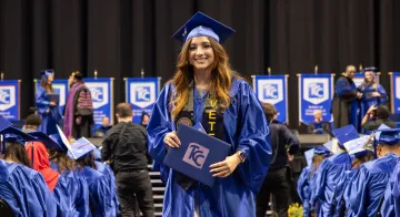 Student holds diploma