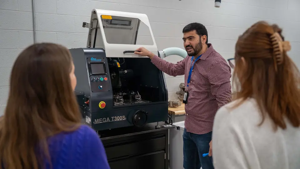 Dr. Anass Nassef shows new lab equipment to TCC faculty and staff