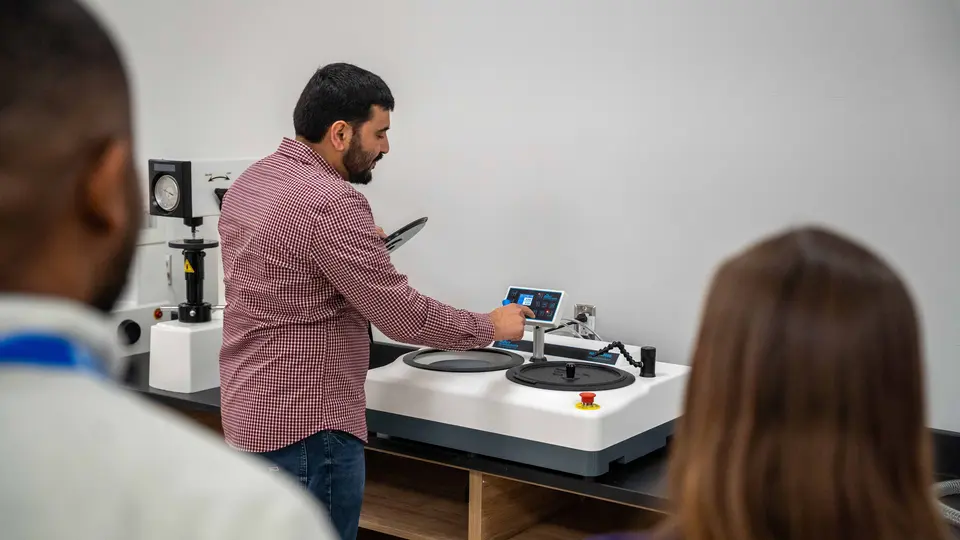 Dr. Anass Nassef shows new lab equipment to TCC faculty and staff