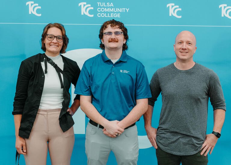 Kelly Parsley, Luke Crocker, and Dallas Elleman smile for a photo